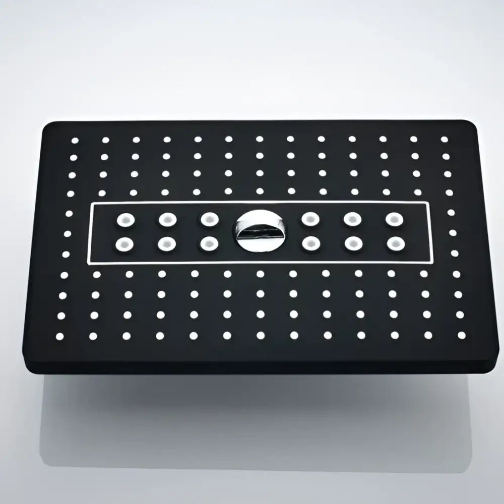 Modern black rainfall shower head with white circular nozzles and central chrome control knob for bathroom use
