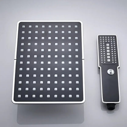 Modern black and chrome rainfall shower head with square rainhead and handheld unit for bathroom use