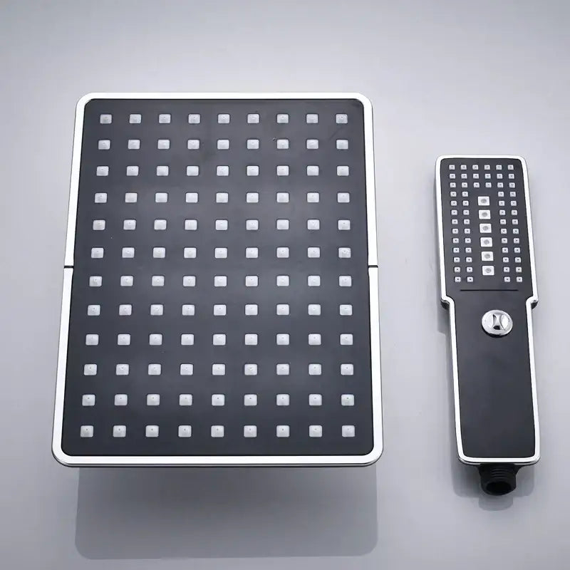 Modern black and chrome rainfall shower head with square rainhead and matching handheld shower wand bathroom set