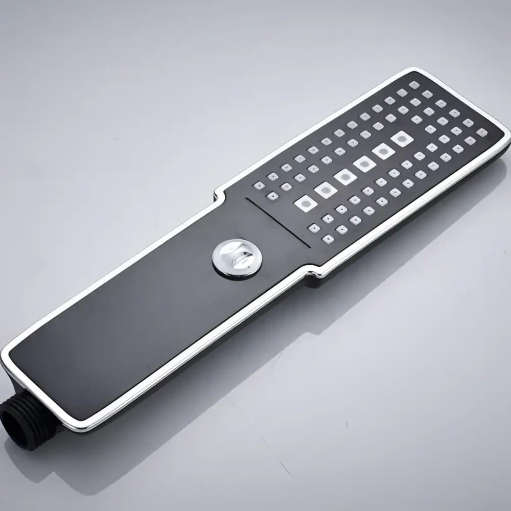 Modern black and chrome rainfall shower head with sleek rectangular design and square nozzles for bathroom use