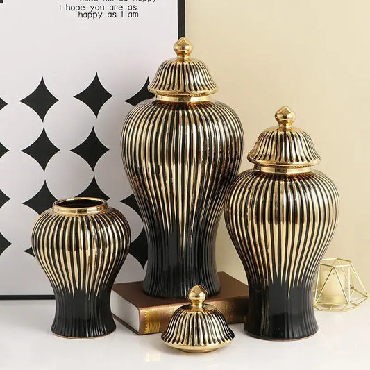 Set of three elegant black and gold ceramic ribbed ginger jar vases with matching golden lids for living room decor