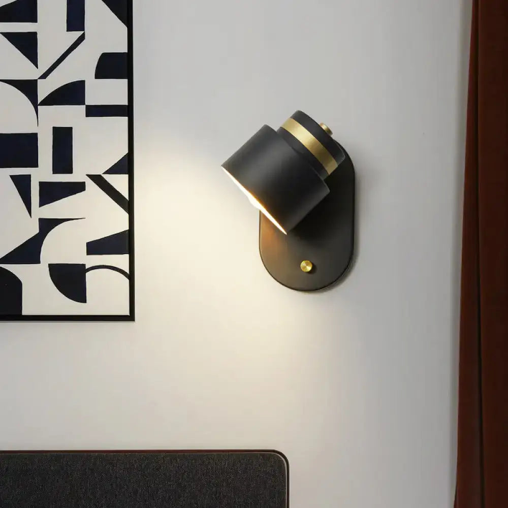 Modern black and gold rotatable led light bedroom wall sconce with matte finish and adjustable design