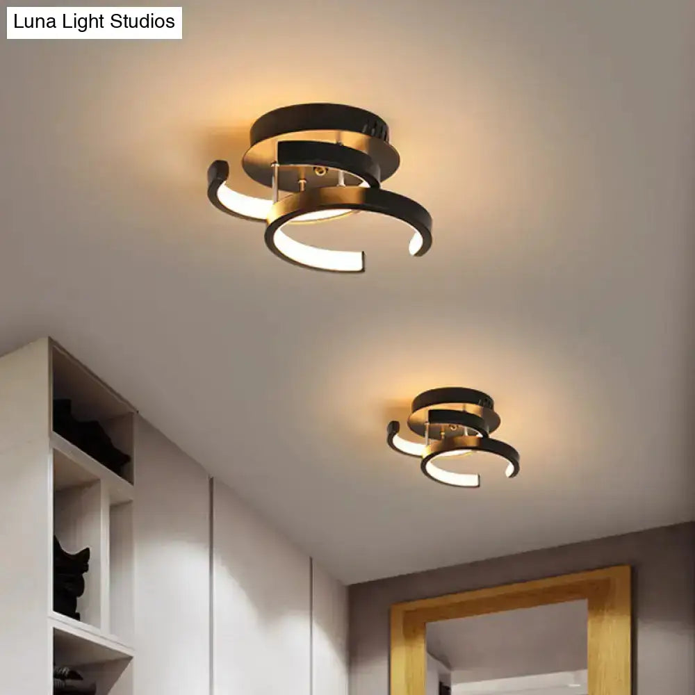 Modern black and gold spiral ceiling lamp with sleek curved rings for exceptional lighting efficiency in round square moon design