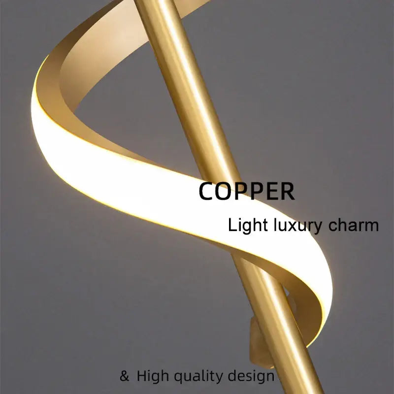 A modern black and gold pendant light with a spiraling copper lamp body and warm glow for dining room use