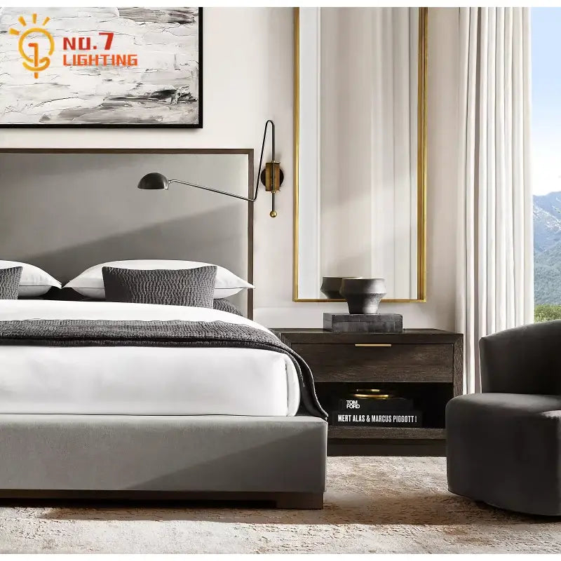 Modern gray upholstered bed with dark wood frame paired with decorbites black gold swing arm wall lamp for living room decor