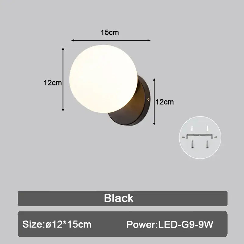 Modern black led wall sconce with frosted glass globe and metal base for bedroom lighting