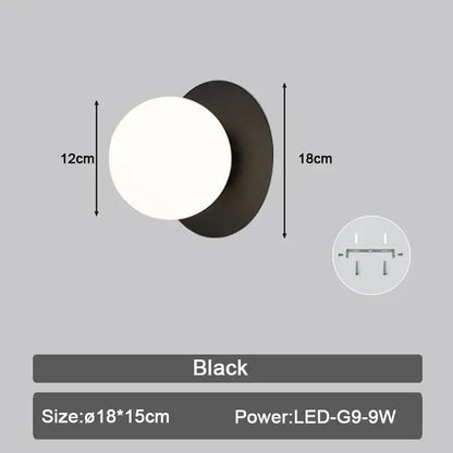 Modern black and gold teardrop led wall sconce with matte finish and frosted glass globe for bedroom lighting