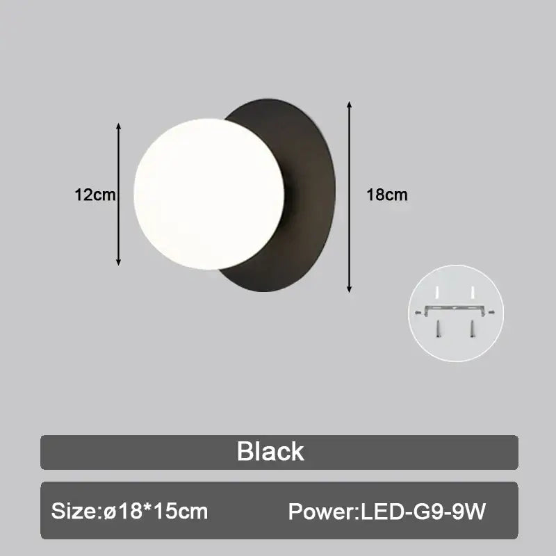 Modern black and gold teardrop led wall sconce with matte finish and frosted glass globe for bedroom lighting