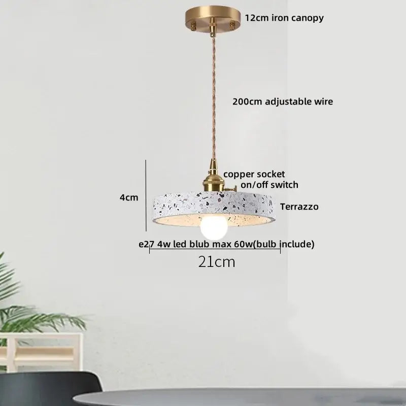 Modern pendant lamp with circular black terrazzo stone shade, brass iron canopy, and copper socket for kitchen decorbites black terrazzo