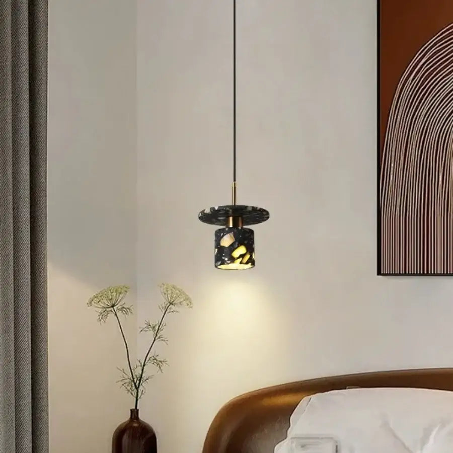 Modern black terrazzo stone pendant lamp with gold accents and geometric cutouts for kitchen decorbites hanging light