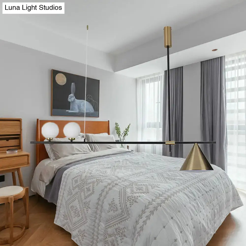 Modern gold-toned pendant light by decorbites with sleek black bar and three lights suitable for 110-120v and 220-240v