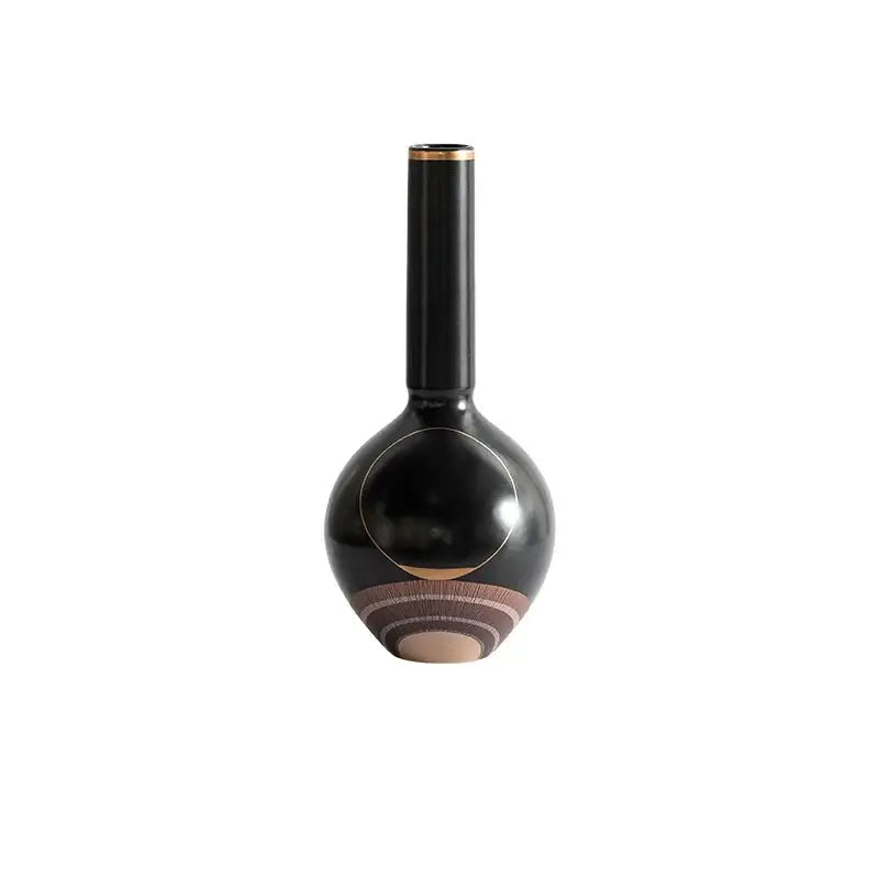 Modern black ceramic vase with slender neck gold rim and earthy circular patterns ideal for decorbites golden tray sets
