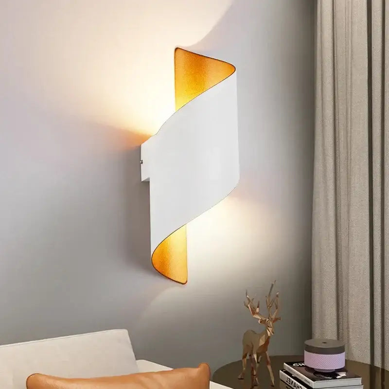 Modern black and gold twisted led wall lamp with sleek white and gold metallic finishes for corridor lighting