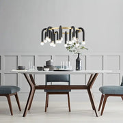 Modern black and gold u shape tube ring chandelier with curved arms and exposed bulbs for dining room lighting