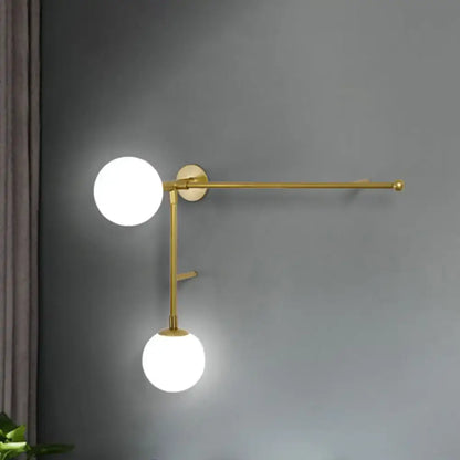 Modern gold-toned wall lamp with frosted glass shades and towel bar featuring direct wired electric modern design