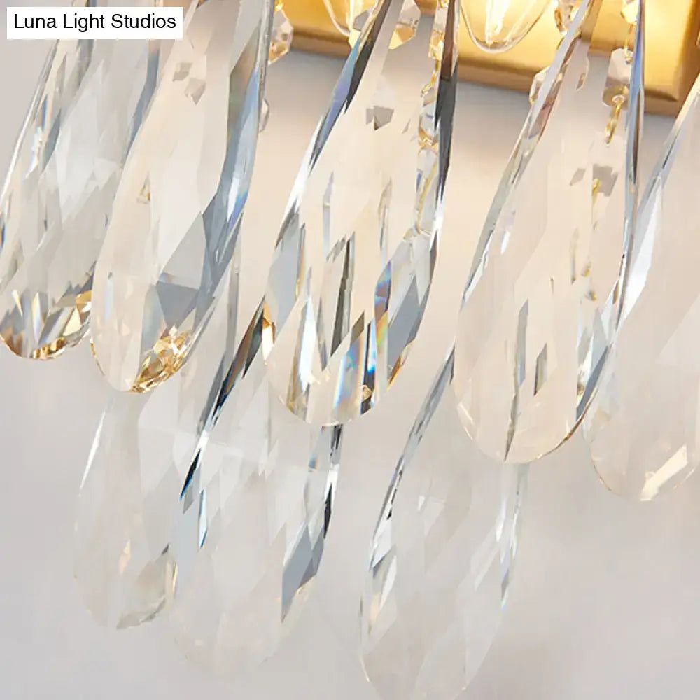 Modern black and gold wall lamp with clear crystal teardrop pendants for elegant bedroom sconce lighting