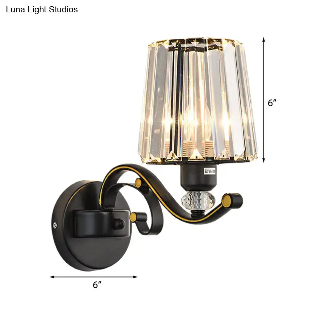 Modern black and gold wall lamp with clear glass faceted crystal shade ideal as a bedroom sconce