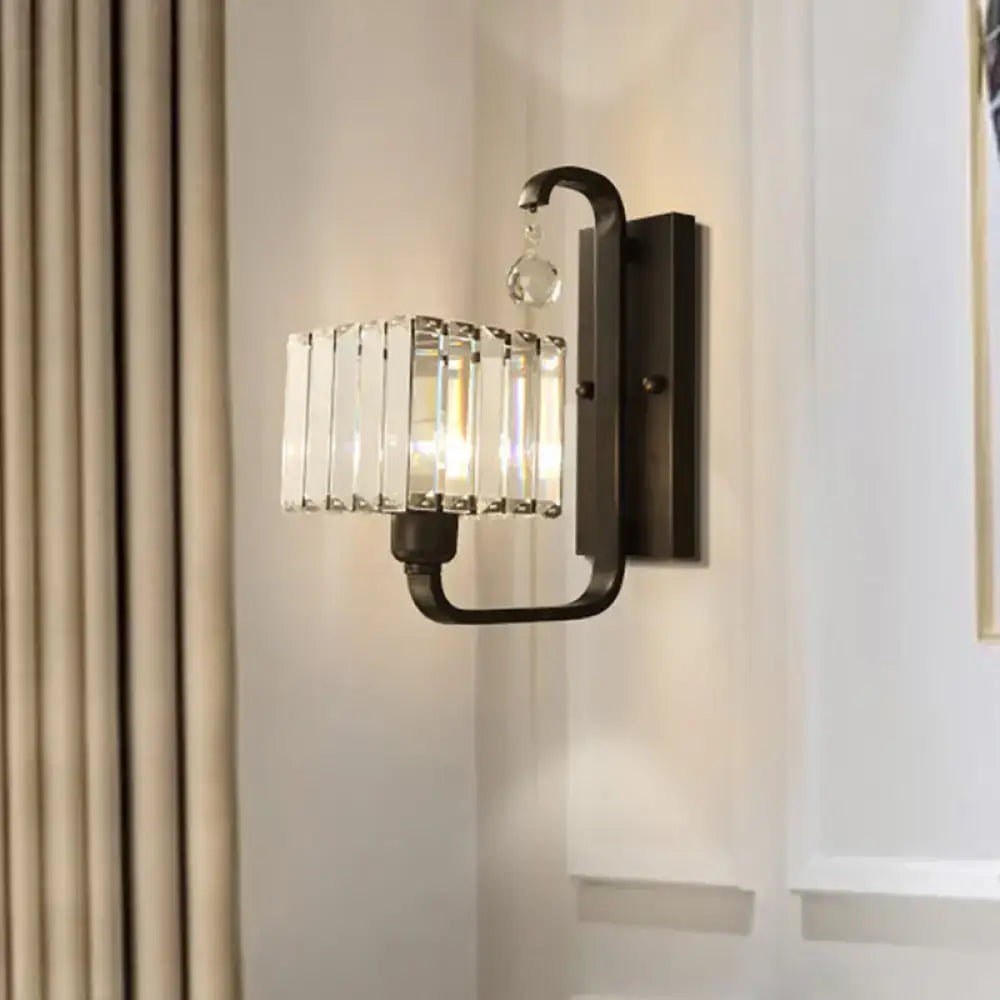 Modern black wall sconce with crystal shade featuring vertical crystal bars and a clear crystal accent for living room