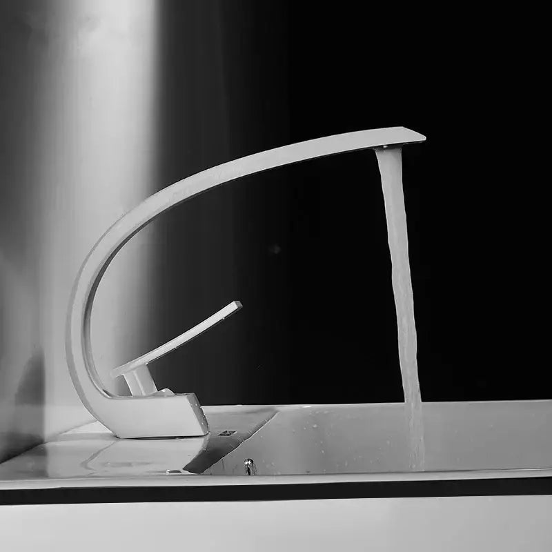 Modern chrome-finished basin faucet with sleek curved design and single lever handle for decorbites black gold bathroom use