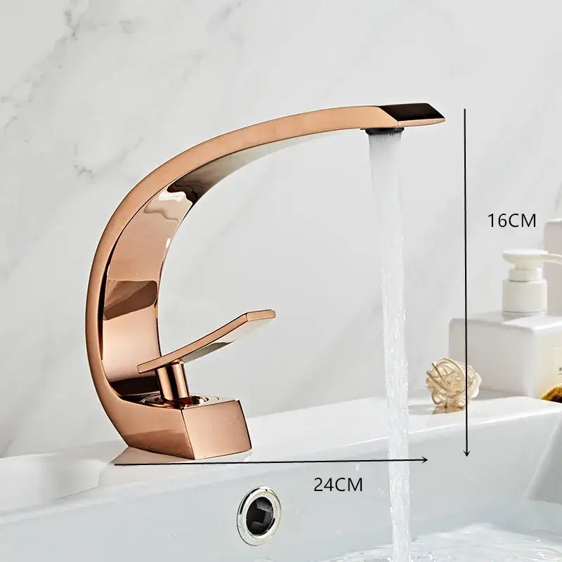 Modern black gold basin faucet with rose gold waterfall spout and sleek curved polished metallic finish for bathroom decorbites