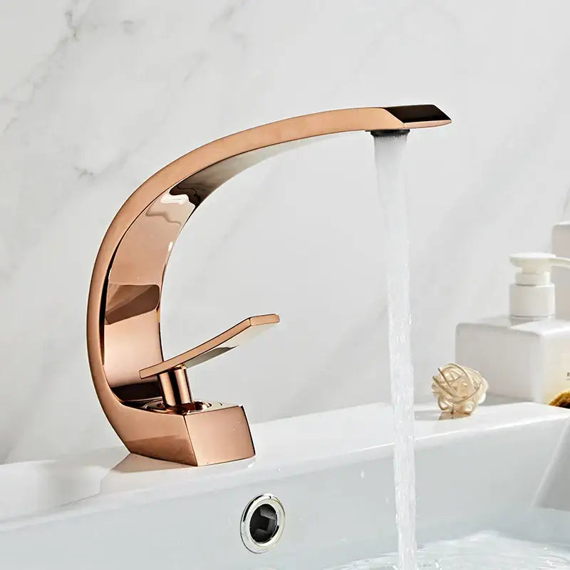 Modern black gold basin faucet with rose gold finish and sleek curved waterfall design for bathroom decorbites black gold