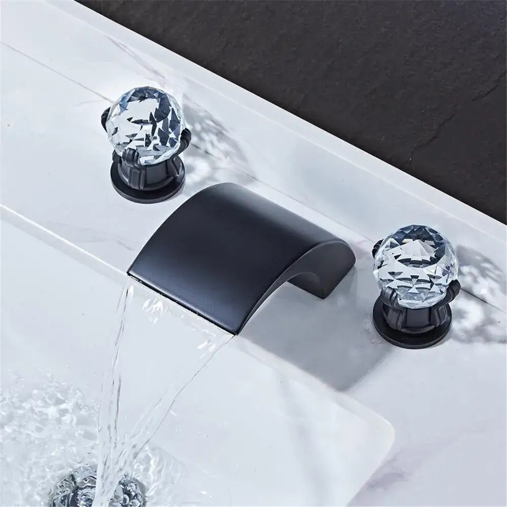 Modern black and gold waterfall basin faucet with black matte finish and crystal clear faceted knob handles decorbites black basin faucet