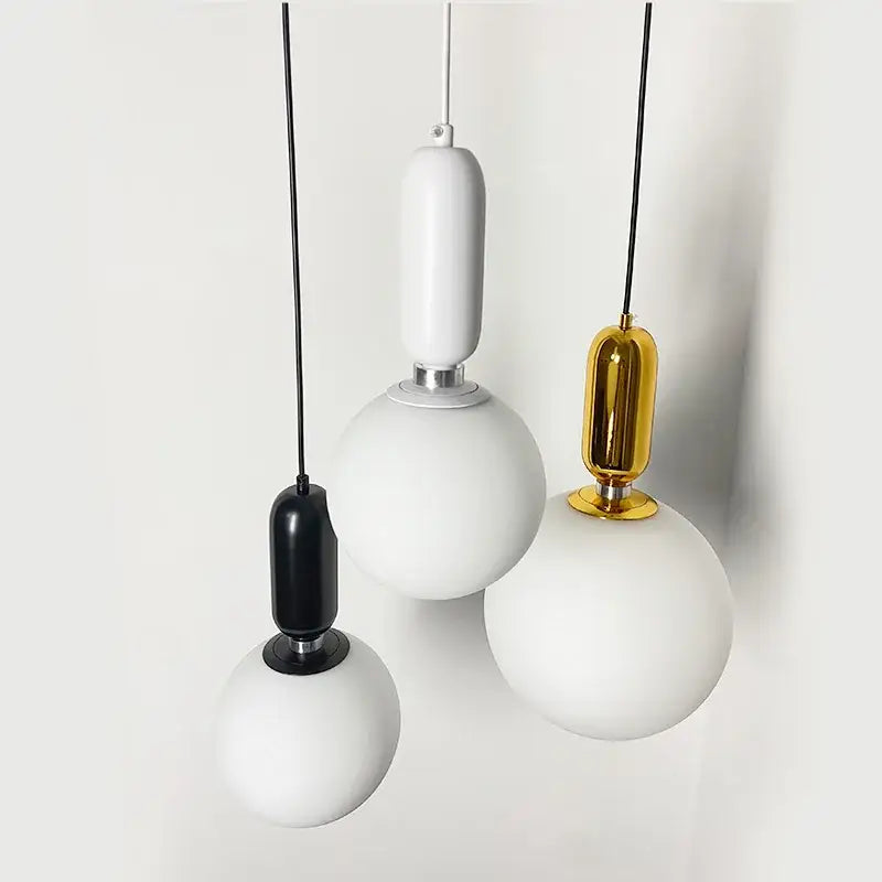 Three modern pendant lights with frosted glass ball led shades in black white and gold for living room decorbites glass ball chandelier