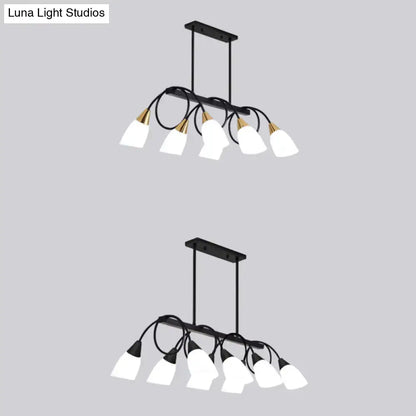 Modern black and gold ceiling light with six white glass shades for dining room island by decorbites