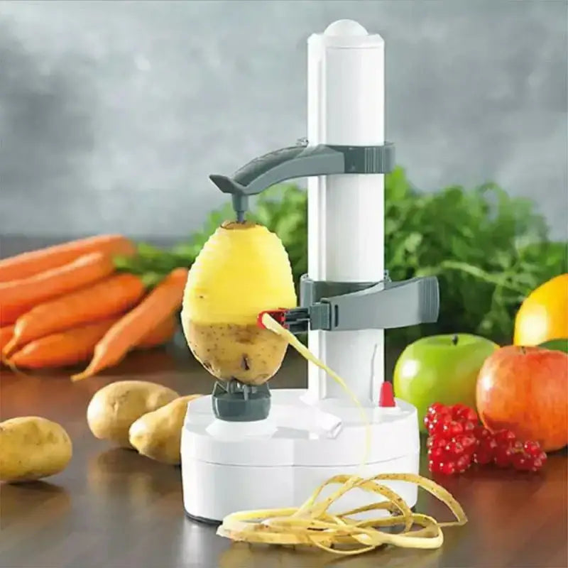 Modern black and gray electric peeler with rotating arm peeling a yellow potato skin fruit slicer gadget in use