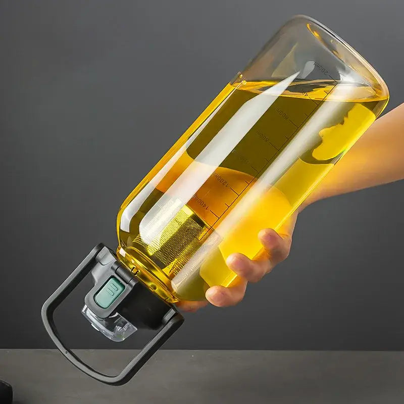 Modern black and green decorbites glass cup with transparent yellow water bottle and mesh strainer for tea separation