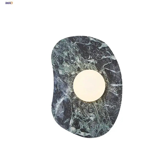 Modern black and green marble wall sconce with circular warm light featuring decorbites green marble stone design