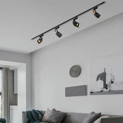 Modern black gu10 7w led track lights with adjustable spotlights on a sleek ceiling rail ideal for kitchen display