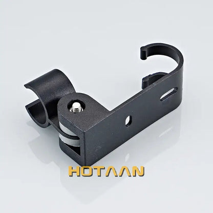 Black metal wall mount bracket with central screw and cutout holes for modern black hand shower holder with hooks