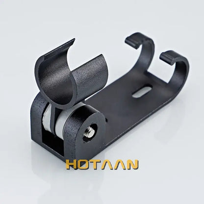 Modern black hand shower holder with hooks featuring a curved black plastic and metal wall mount bracket roller clamp