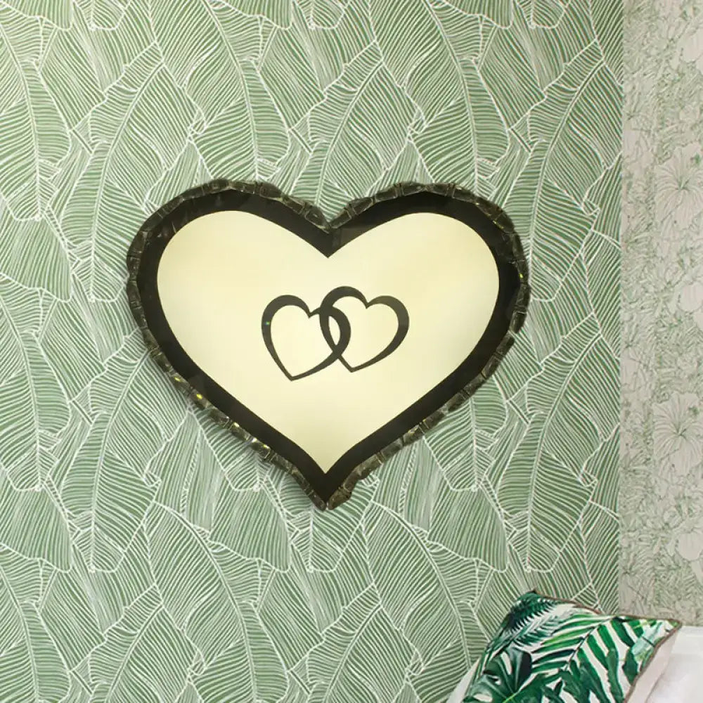 Modern black heart crystal shade wall sconce with textured frame and interlocking hearts for bedroom lighting