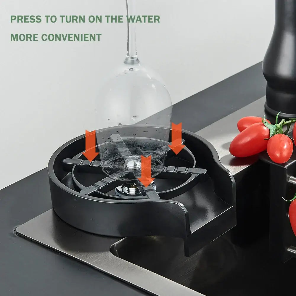 Modern black high pressure glass cup washer with clear glass pitcher and orange arrows showing water flow direction