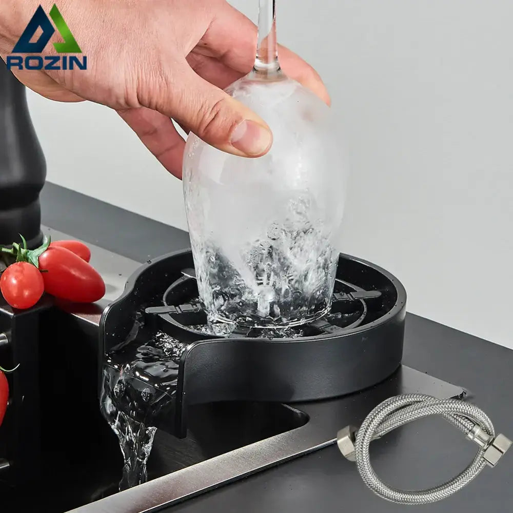 Modern black plastic ice maker base with spout flowing water into clear glass bottle for decorbites glass cup washer use