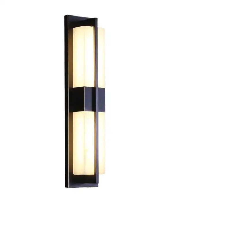Modern black imitation marble led wall light with two vertical frosted glass panels emitting warm glow decorbites led wall
