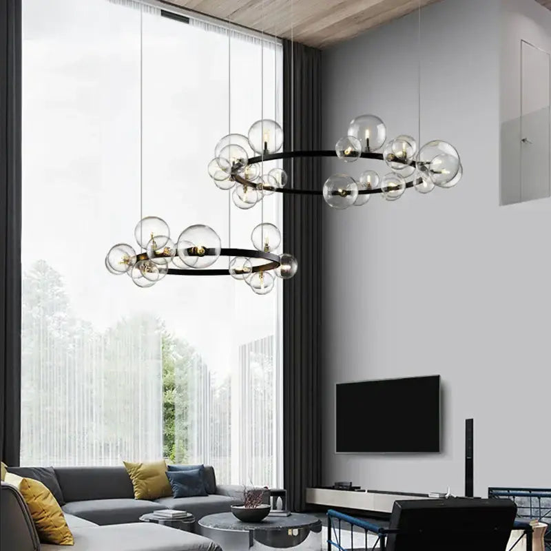 Modern black industrial glass pendant chandelier with clear glass globe bulbs in two concentric rings for kitchen lighting