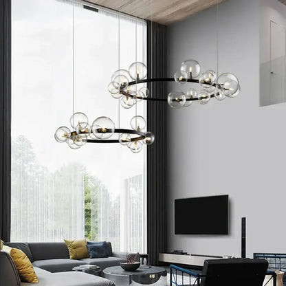 Modern black industrial glass pendant chandelier with clear glass globe bulbs in two concentric rings for kitchen lighting
