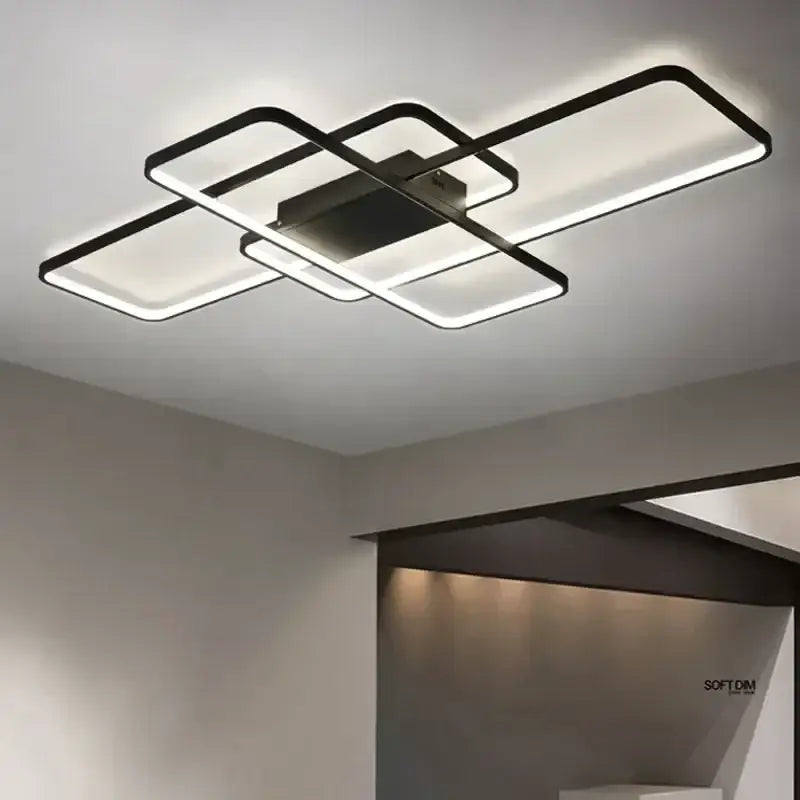 Modern black metal decorbites dimmable ceiling light with intersecting rectangular LED panels emitting bright glow