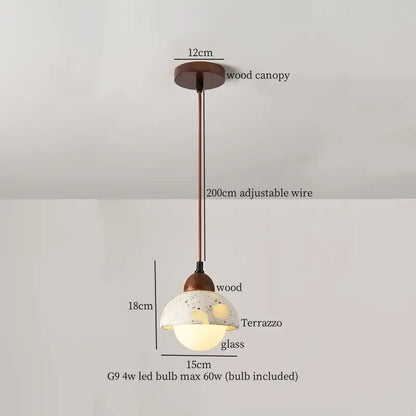 Rustic pendant light with terrazzo glass shade suspended by adjustable bronze wire, ideal for decorbites iron marble led settings