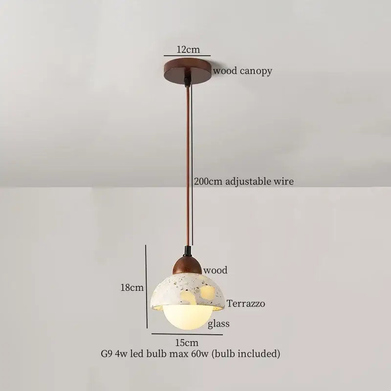 Rustic pendant light with terrazzo glass shade suspended by adjustable bronze wire, ideal for decorbites iron marble led settings