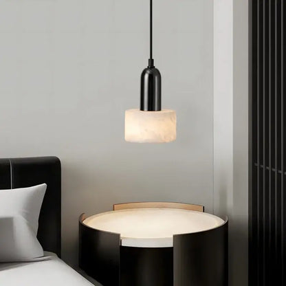 Modern black iron and white marble led pendant light with cylindrical matte fixture and warm stone diffuser decorbites iron marble