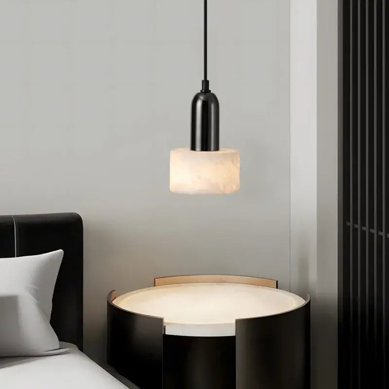 Modern black iron and white marble led pendant light with cylindrical matte fixture and warm stone diffuser decorbites iron marble