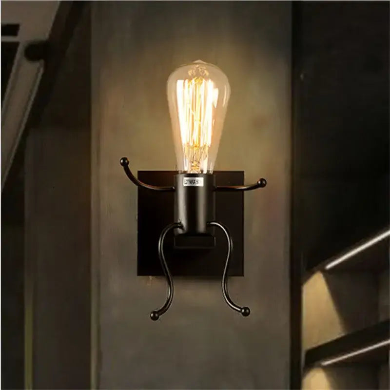 Black wrought iron wall sconce with glowing filament bulb for modern decorbites cartoon doll kids bedroom ladder light