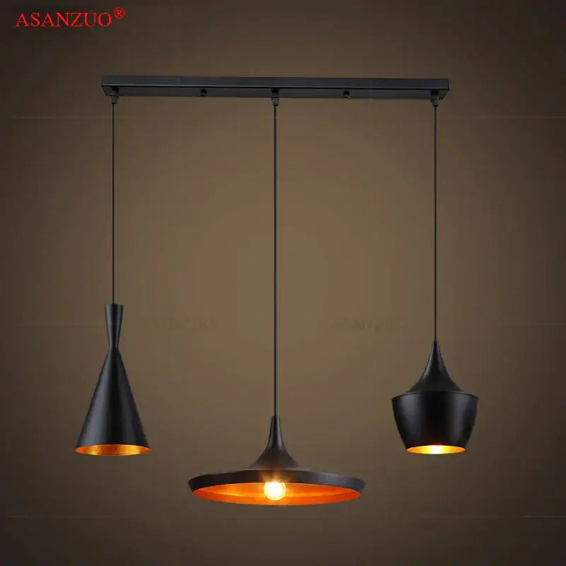 Modern black iron chassis ceiling panel dining room light with black metal pendant lights and warm amber interiors