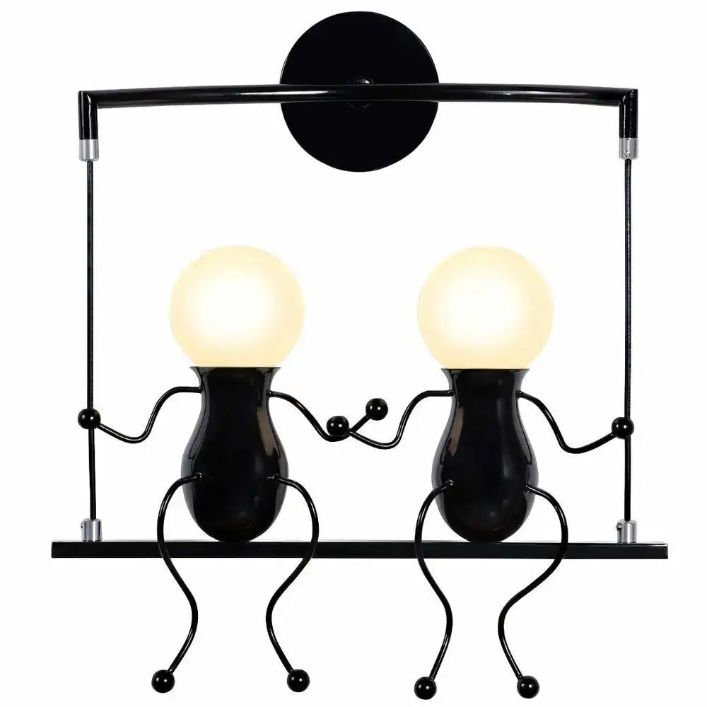 Modern black iron wall sconce with two whimsical hand-holding figures and glowing spherical heads for bedroom decorbites creative led
