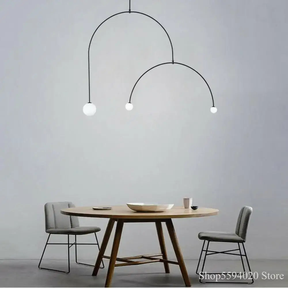 Modern black iron line chandelier with three white glass bulbs for living room featuring decorbites iron line design