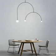 Modern black iron line chandelier with three white glass bulbs for living room featuring decorbites iron line design